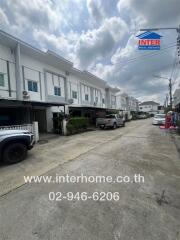 View of a residential street with townhouses