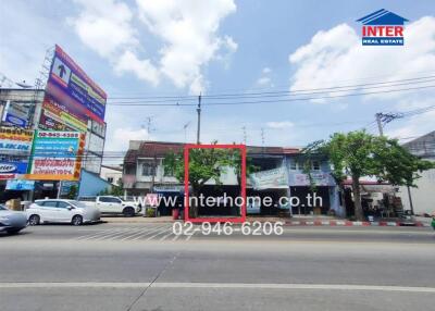 Street view of a building with commercial signage