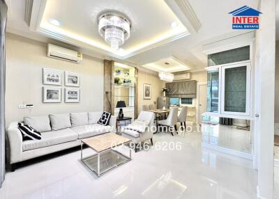 Modern living room with chandelier and air conditioning