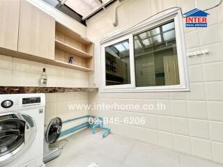 Bright and clean laundry room with washer