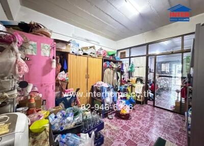 Cluttered storage room filled with various items and furniture