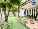 Outdoor patio with seating area and garden