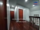 Dimly lit hallway with wooden floors and multiple doors