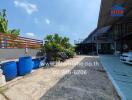 Outdoor view of a residential property with driveway and garden area.