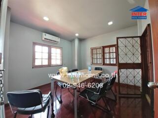 Office space with wooden flooring and conference table