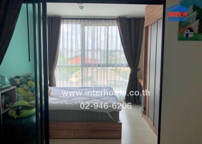 Cozy bedroom with large window and glass sliding door