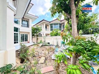 Exterior view of two houses with garden