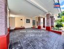 Covered car porch area with pillars and tiled flooring