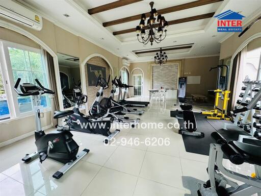 Home gym with various exercise machines and equipment