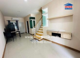 Living room with stairway and study area