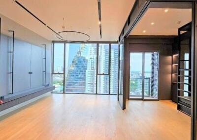 Modern living room with large glass windows and city view