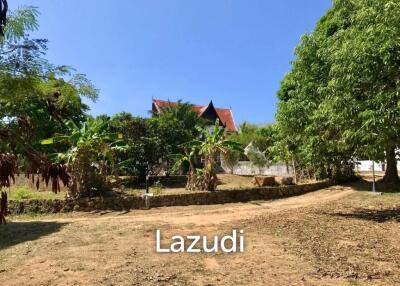 3.75 Rai Land with Spacious 3-Story Villa and Additional 3-Story House, Walking Distance to Yanui Beach