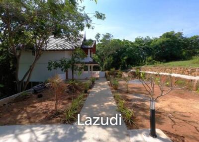 3.75 Rai Land with Spacious 3-Story Villa and Additional 3-Story House, Walking Distance to Yanui Beach