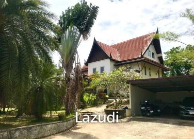 3.75 Rai Land with Spacious 3-Story Villa and Additional 3-Story House, Walking Distance to Yanui Beach