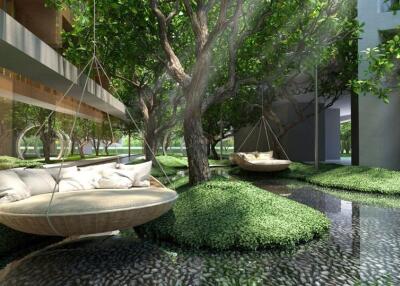 Outdoor seating area with hanging chairs and lush greenery