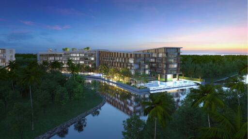 Modern apartment complex with water view at dusk
