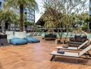 Outdoor pool area with lounge chairs and seating