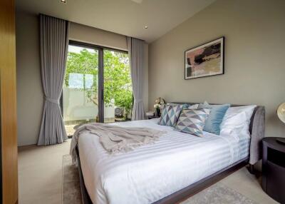 Modern bedroom with large window and stylish decor
