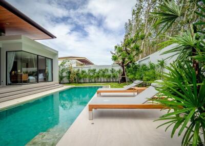 Modern house with swimming pool and outdoor seating