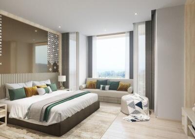 Spacious and modern bedroom with a large bed, sitting area, and natural light