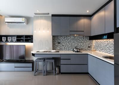 Modern kitchen with sleek cabinetry and integrated appliances