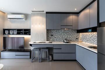 Modern kitchen with sleek cabinetry and integrated appliances