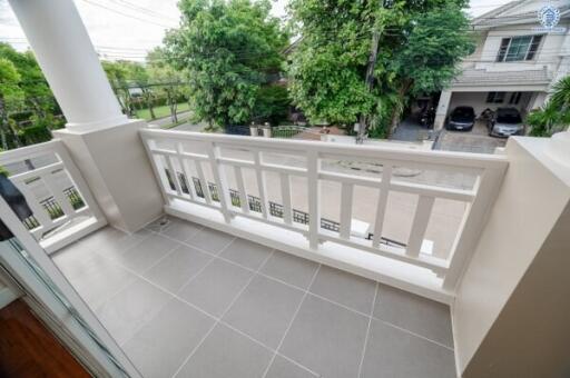 Balcony with railing and view of neighborhood