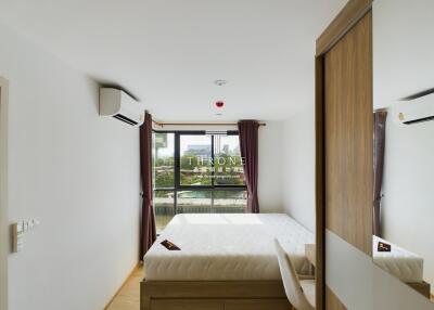 Modern bedroom with large window