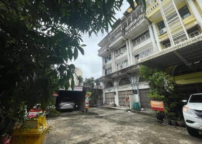 Front view of residential buildings with parking area