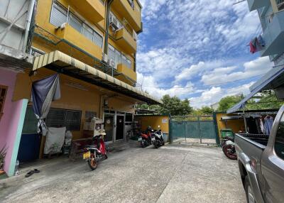 Exterior view of a building with motorcycles parked