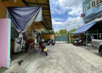 Outdoor space with motorcycles and a covered area