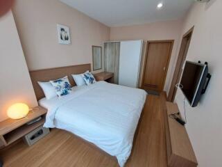 Well-furnished bedroom with double bed and wardrobe