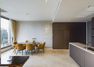 Modern dining room and kitchen area with large window