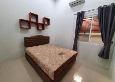Modern bedroom with air conditioning and simple decor