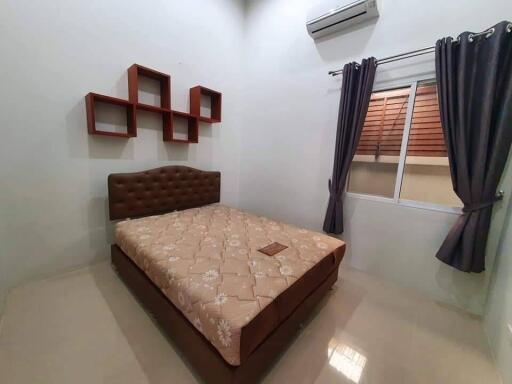 Modern bedroom with air conditioning and simple decor