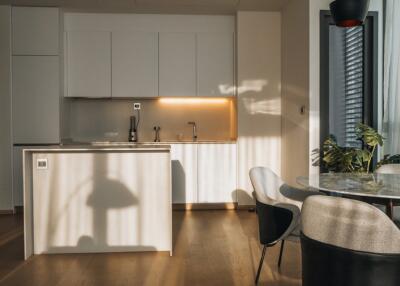 Modern kitchen with dining area and natural light