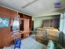 Bedroom with wooden cabinets and stacked mattresses