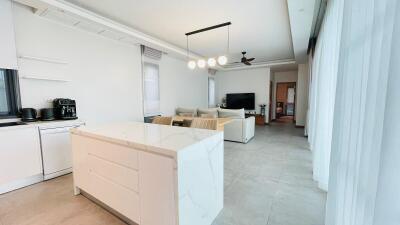 Modern living area with kitchen island and seating