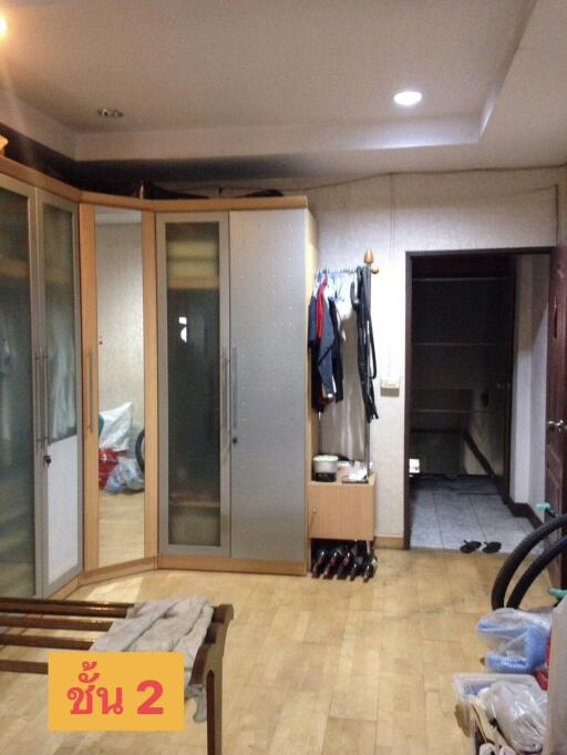 Bedroom with closet and wooden flooring