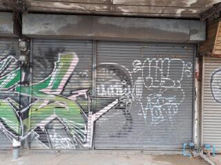 Graffiti on a closed storefront shutter