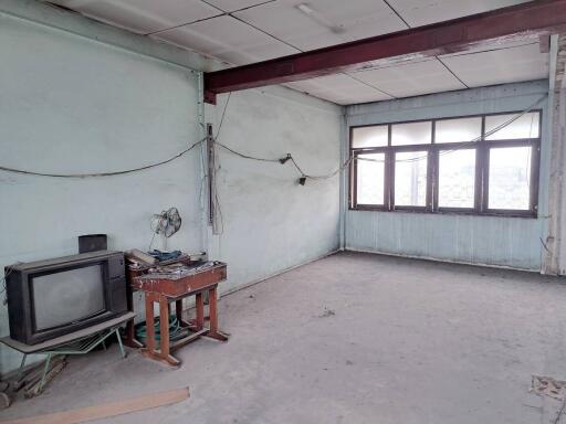 Empty room with old television and desk