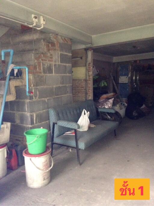 Unfinished basement with storage and seating area