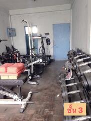 Home gym with various equipment