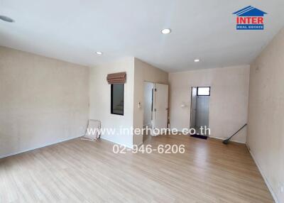 spacious unfurnished living room with hardwood floor