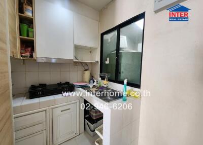 Small urban kitchen with basic amenities and storage space.