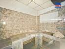 Kitchen area with tiled countertops and backsplash