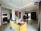 Main living space with staircase and dining area