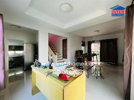 Main living space with staircase and dining area