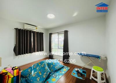 Bedroom with window, air conditioning, and children