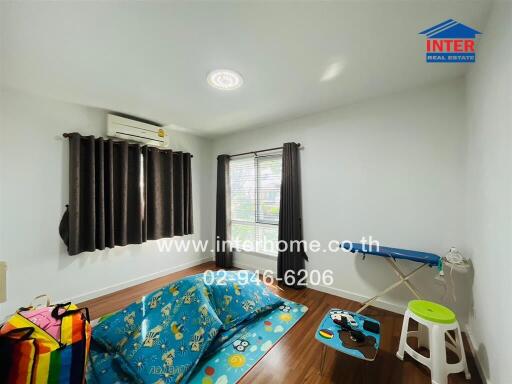 Bedroom with window, air conditioning, and children